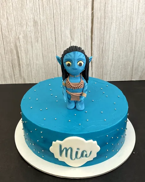 Tarta azul con figura de Avatar