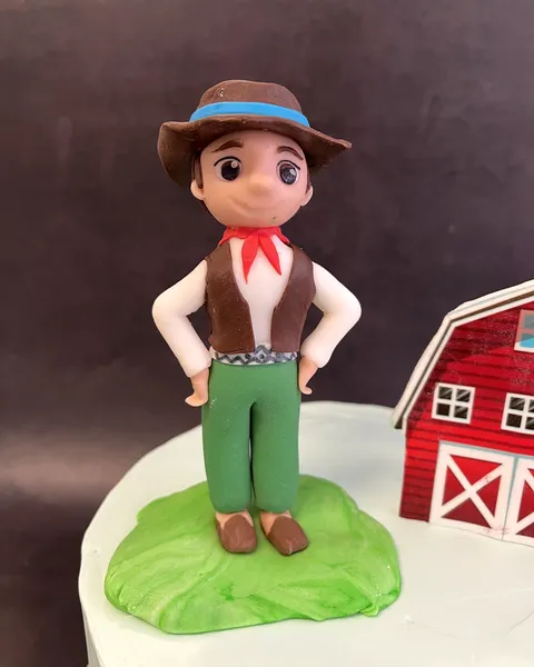Granjero de fondant con granero rojo