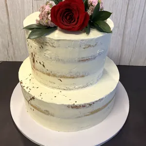Tarta semidesnuda de dos pisos con rosa